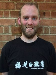 Photo of the author, Tim Rutherford-Johnson, wearing his FWC kung fu uniform