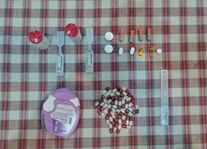 A pile of pills, capsules, inhalers, and ampoules, needed by Tim every day to control his cystic fibrosis