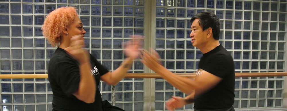 Crystal practises blocking with Dennis Ngo, Chief Instructor Fujian White Crane Kung Fu & Tai Chi Martial Arts