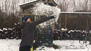 Instructor Richard Wagstaff, Fujian White Crane Kung Fu & Tai Chi Martial Arts Club 9FWC Kung Fu) punching a snowball as part of his Winter training