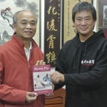 Dennis Ngo presents Su Ying Han with his signed copy of Danil Mikhailov's book