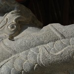 Stone dragon wrapped around a pillar