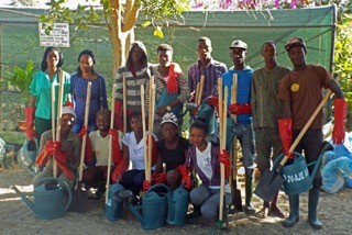 Aspyre Africa 1st cohort of horticultural students with tools provided from a donation by FWC Kung Fu